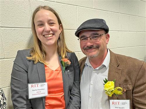 Kenmore East graduate Rachel Hamilton poses with Kenmore East music teacher Phil Aguglia